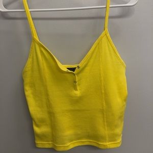 Yellow crop top.